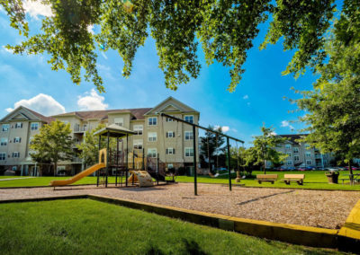Child-friendly playground with spacious field for residents on Saucon View apartment grounds in Bethlehem, PA