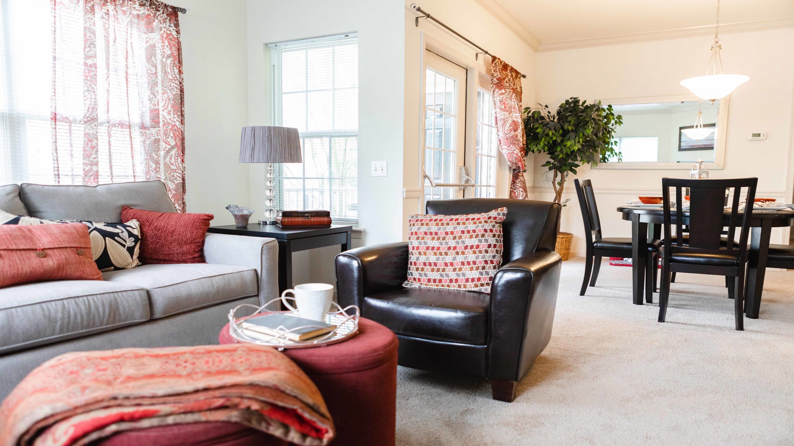 Lovely living room with open dining room floor layout for conveience in Saucon View apartments